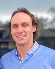 Smiling man, blue shirt